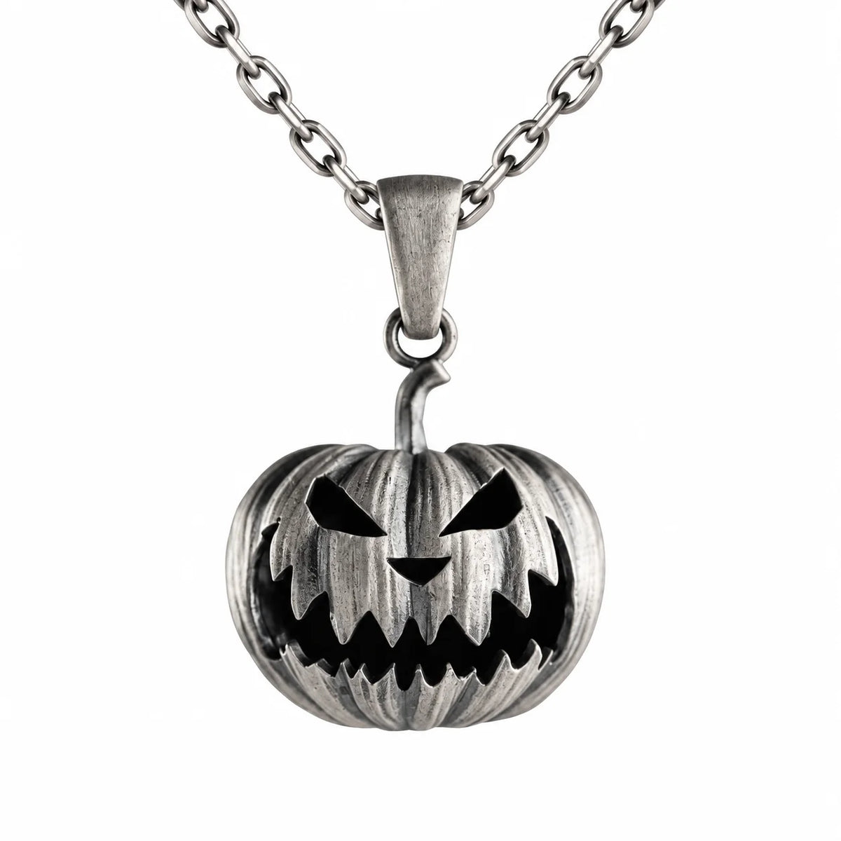 A silver-toned metal pendant necklace featuring a carved jack-o'-lantern pumpkin design with black recessed details, suspended from a matching chain on a plain white background.