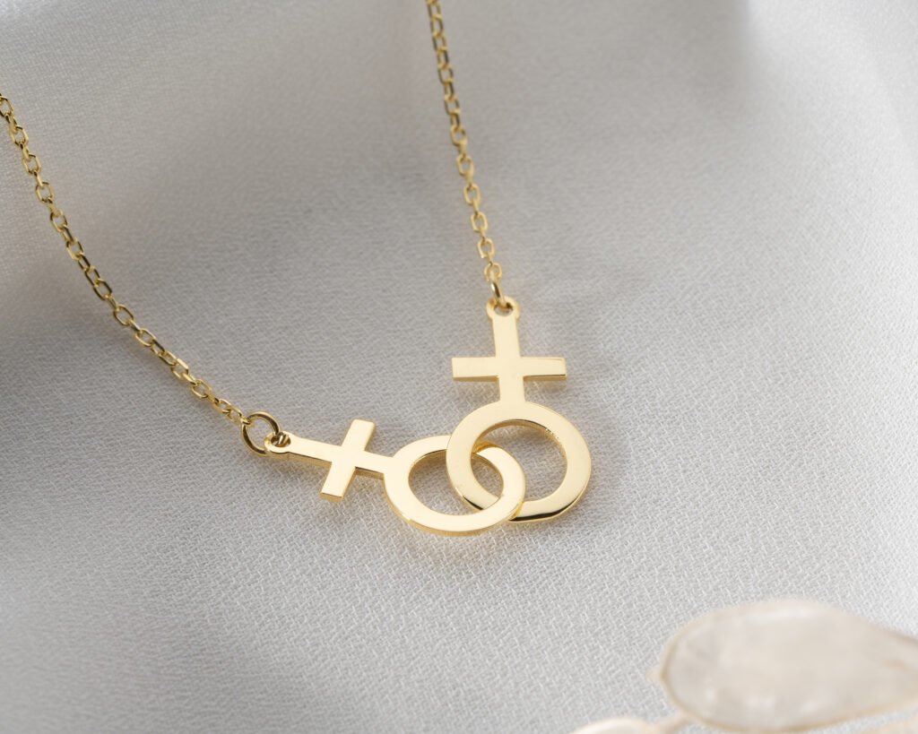 Gold linked gender symbols necklace