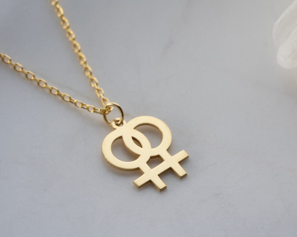 gold interlocked female symbols pendant