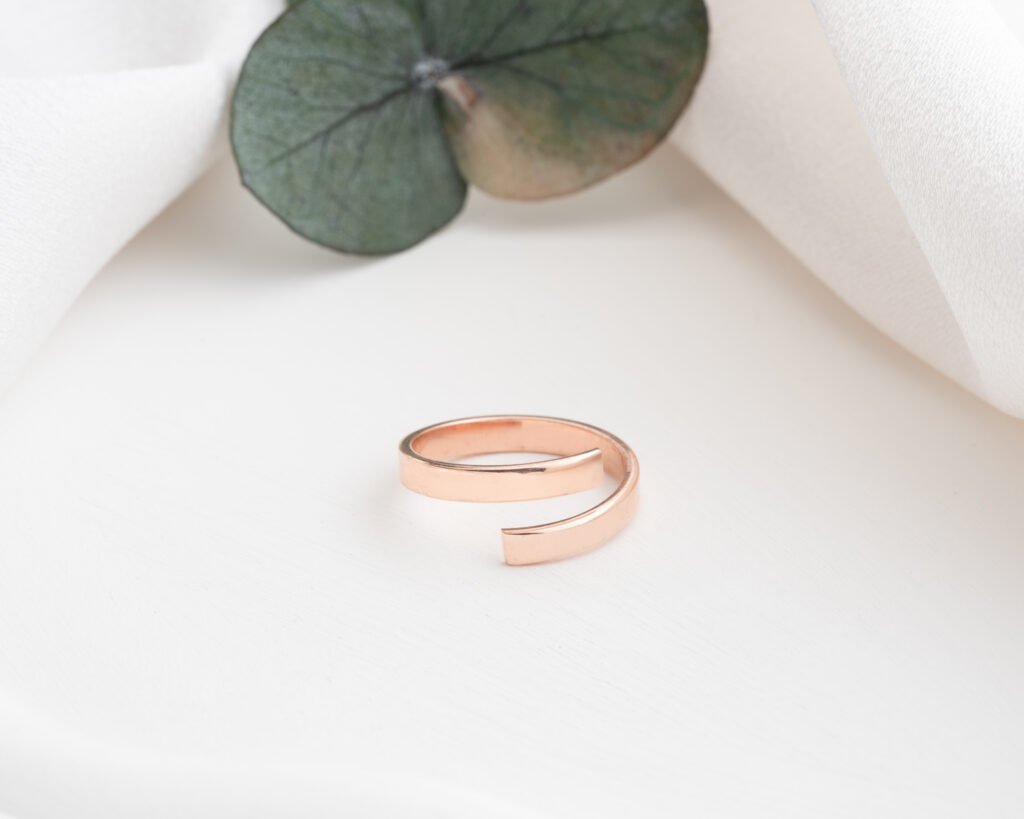 rose gold spiral ring on white background