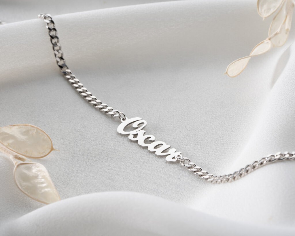 silver personalized name anklet on ankle close-up